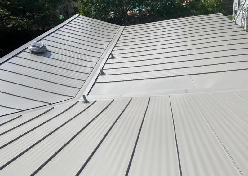 Solar attic fan installed on a metal roof for Roof Ventilation in Valinda